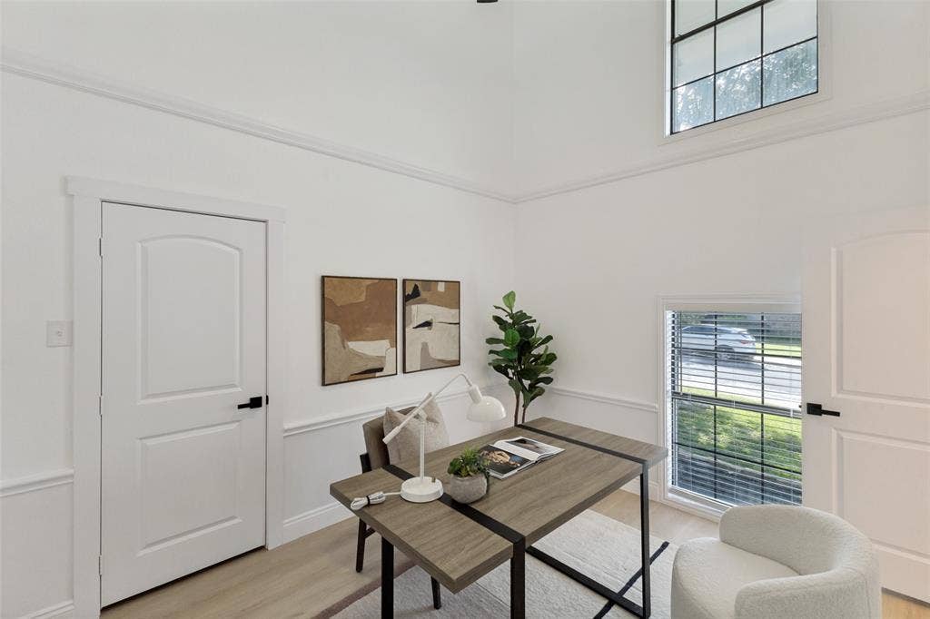 4721 Fallon Place, Dallas, TX 75227 Vaulted ceiling with crown molding, wainscoting, luxury vinyl plank flooring, and a large window with blinds