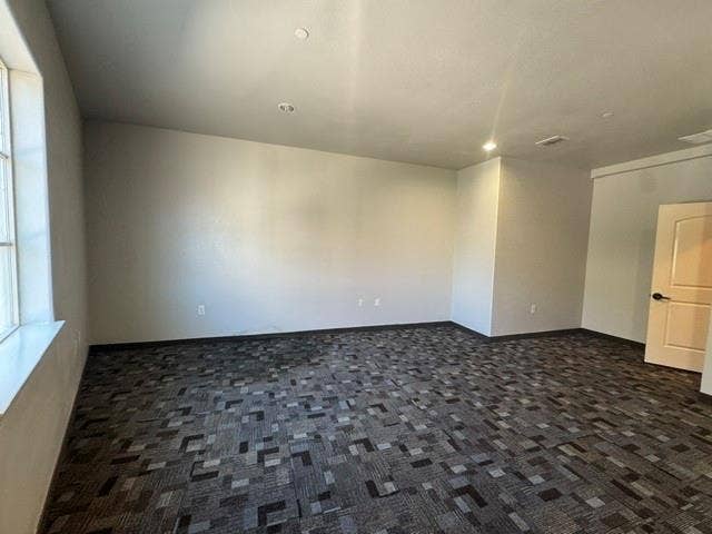 6675 Mediterranean Drive, #202, McKinney, TX 75072 Recessed lighting, patterned carpeting, neutral wall finishes, and a light-colored interior door