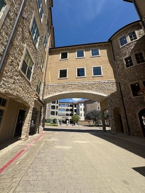 Stone-clad exterior architecture with multiple windows