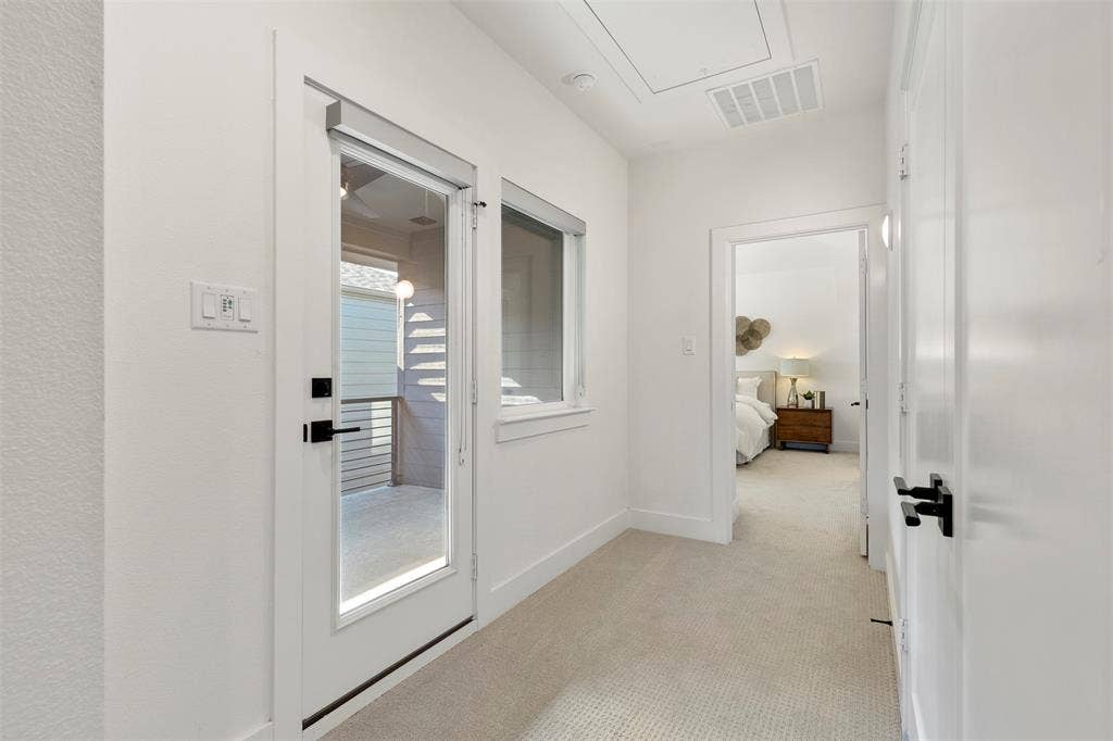 This private, expansive second-level outdoor patio serves as a serene retreat, offering an ideal space for enjoying your morning coffee or simply unwinding and relaxing in a peaceful, elevated setting.
