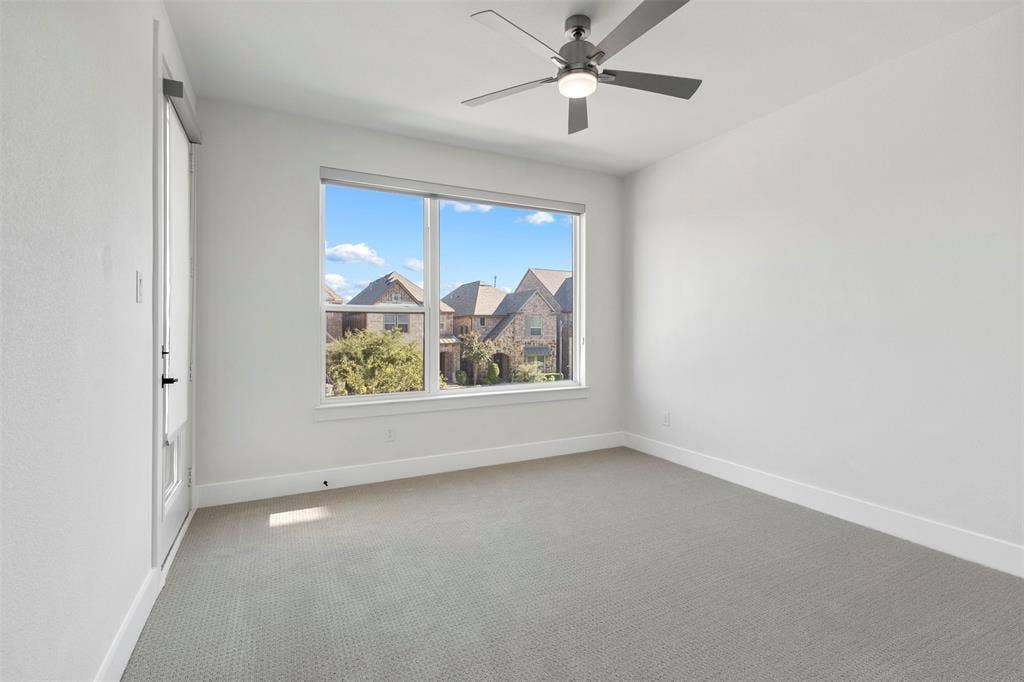 This spacious and light-filled secondary bedroom is conveniently located on the second level of the home, offering residents both privacy and comfort. The room features direct access to a private, oversized balcony that provides a perfect outdoor retreat for relaxation or enjoying the surrounding views.