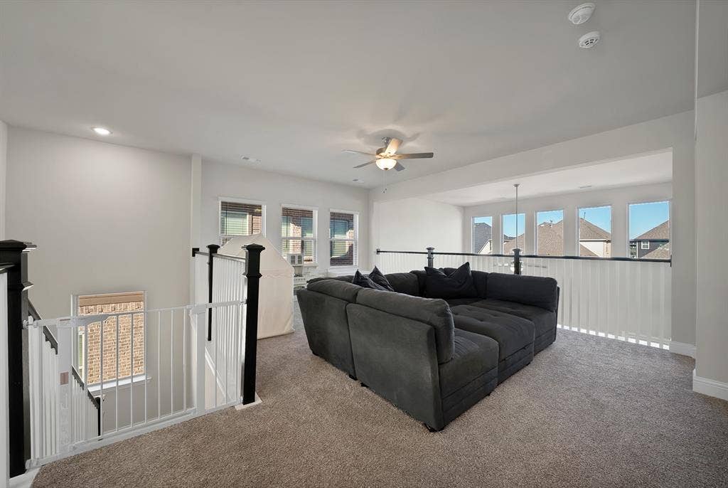 1837 Averi Lane, Farmers Branch, TX 75234 Spacious loft area featuring a ceiling fan, recessed lighting, and multiple windows