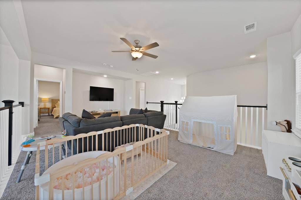 1837 Averi Lane, Farmers Branch, TX 75234 Spacious carpeted upper-level area featuring a ceiling fan, recessed lighting, white walls, and black and white railings