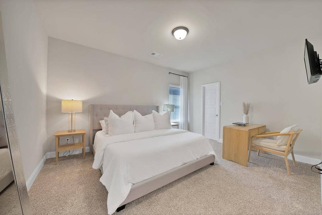 1837 Averi Lane, Farmers Branch, TX 75234 Neutral-toned walls complement plush carpeting