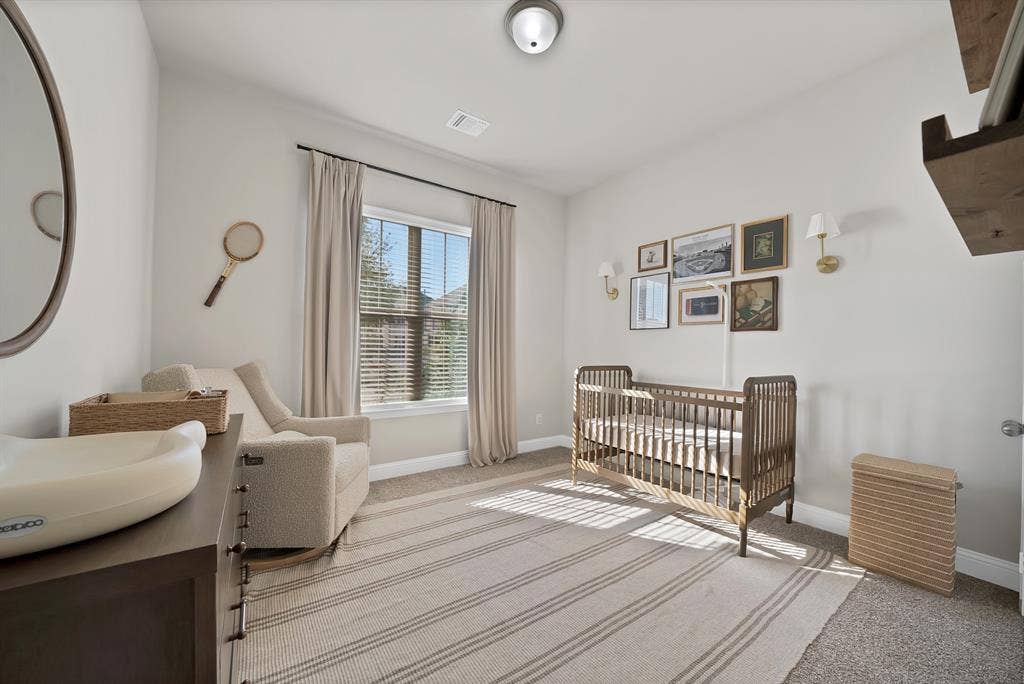 1837 Averi Lane, Farmers Branch, TX 75234 Recessed ceiling light fixture, large window with blinds and drapes, and wall-mounted sconces
