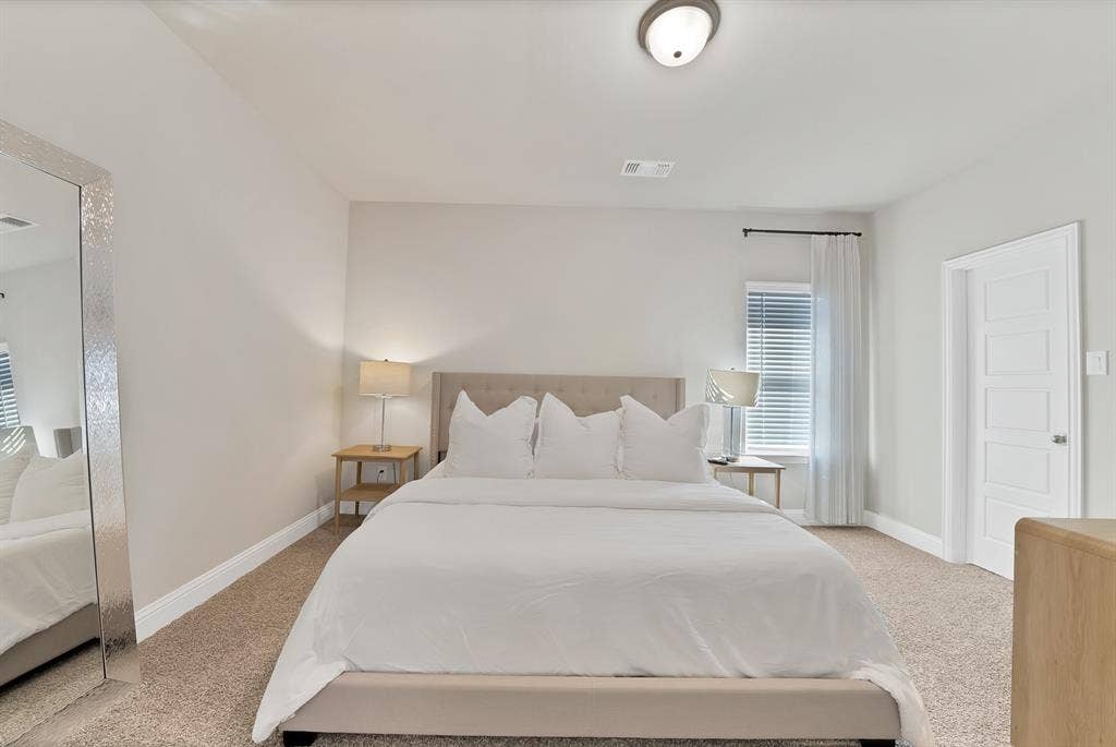1837 Averi Lane, Farmers Branch, TX 75234 Neutral-toned walls complement plush carpeting