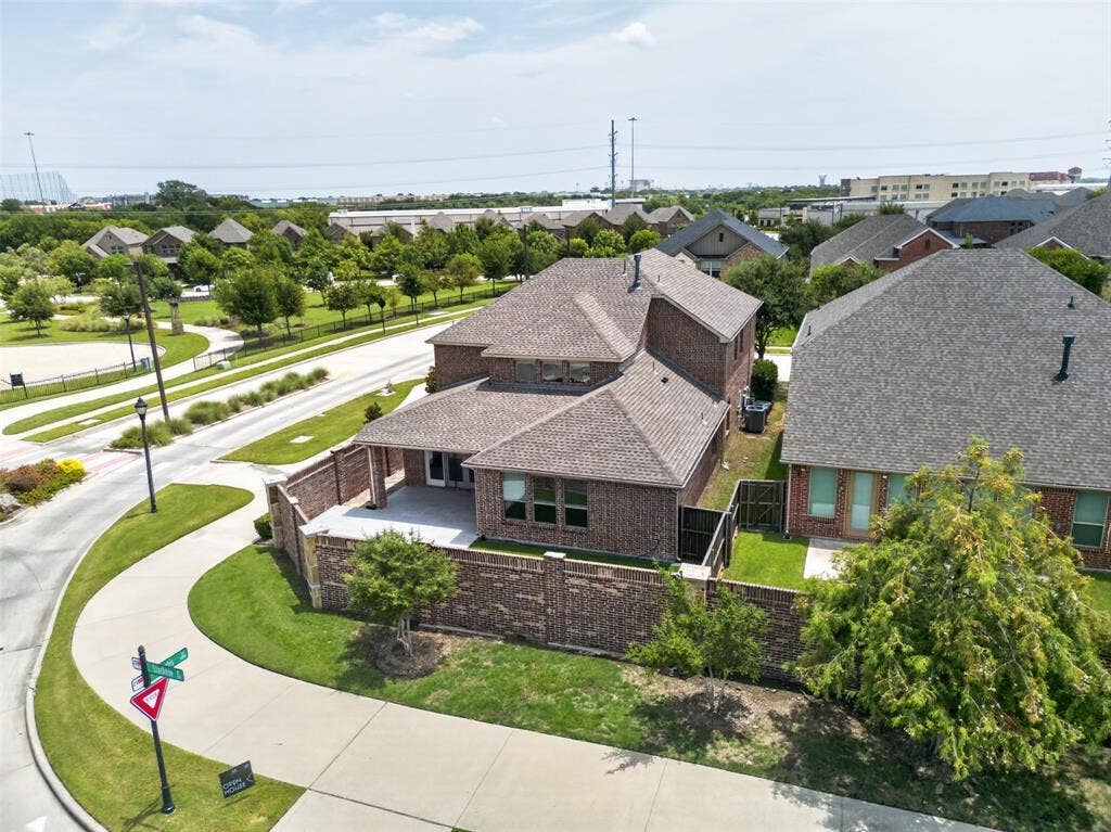 702 Callaway Drive, Allen, TX 75013 Brick exterior with a covered patio and private fenced yard
