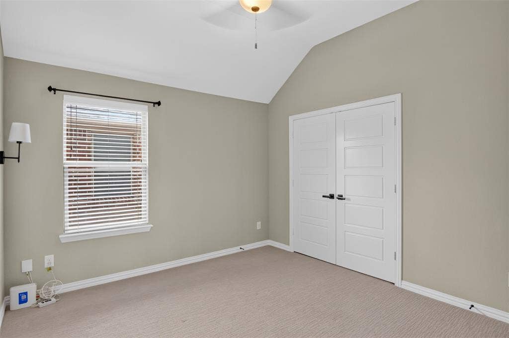 702 Callaway Drive, Allen, TX 75013 Vaulted ceiling, ceiling fan, neutral wall paint, window with blinds, carpeted flooring