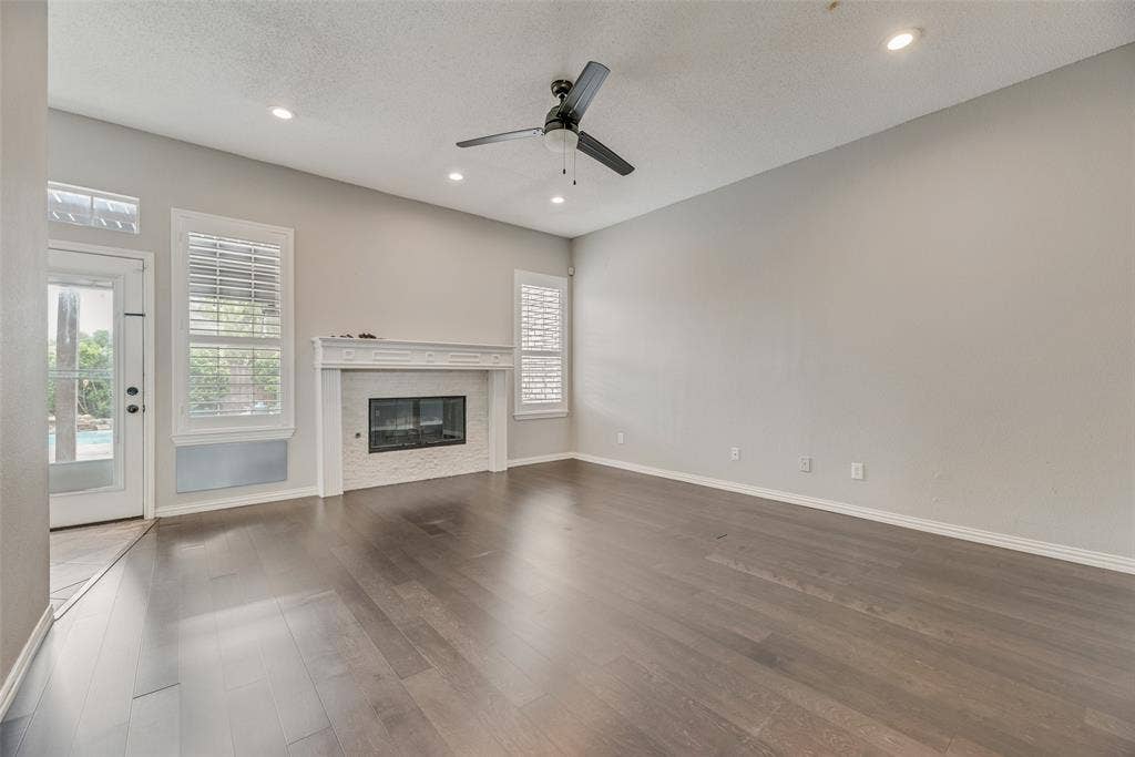 Wood-finish flooring, recessed lighting, and a ceiling fan