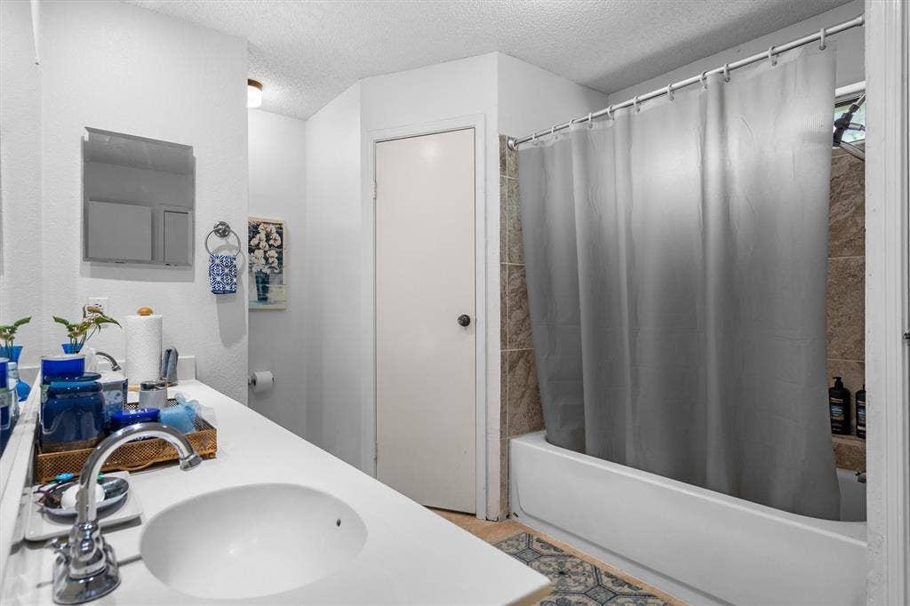 Built-in vanity with an integrated sink and chrome faucet