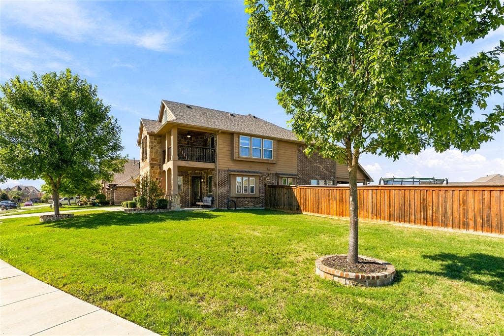 2820 Mariposa Drive, Grand Prairie, TX 75054 Additional exterior view showcasing the home's charming architecture.