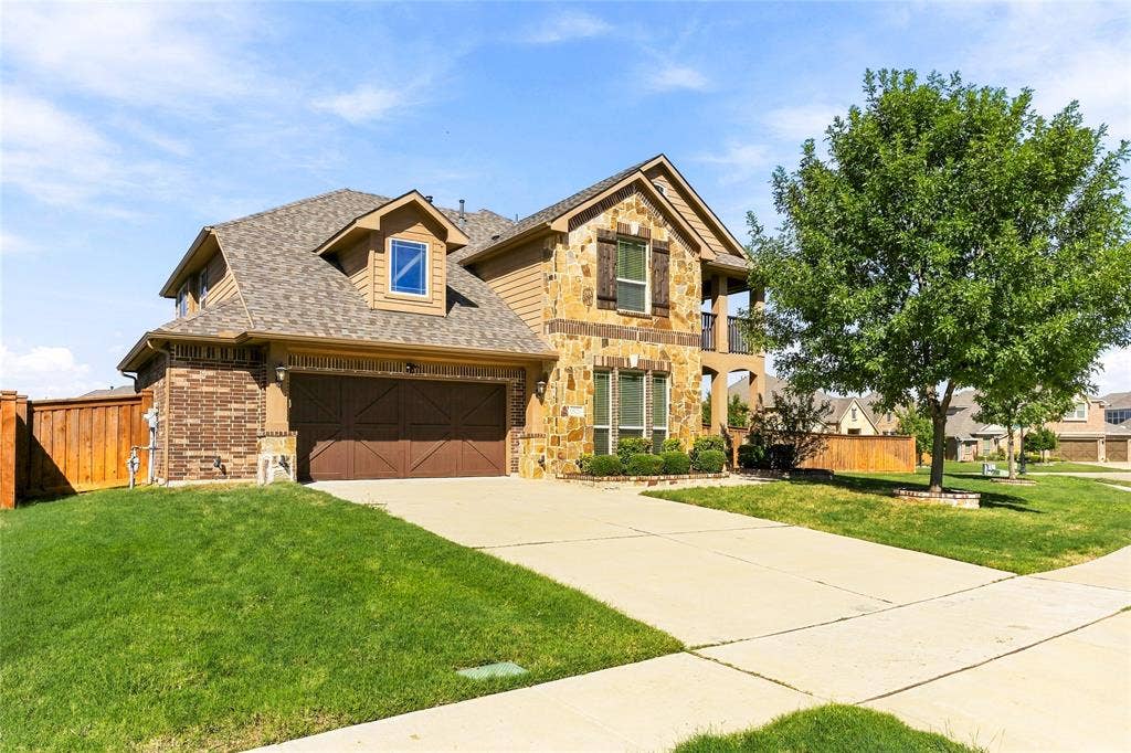 2820 Mariposa Drive, Grand Prairie, TX 75054 Beautiful brick exterior with inviting curb appeal and a welcoming front entry.