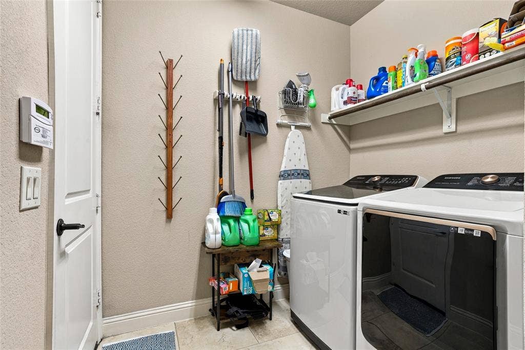 2820 Mariposa Drive, Grand Prairie, TX 75054 Functional utility room with additional storage and workspace.