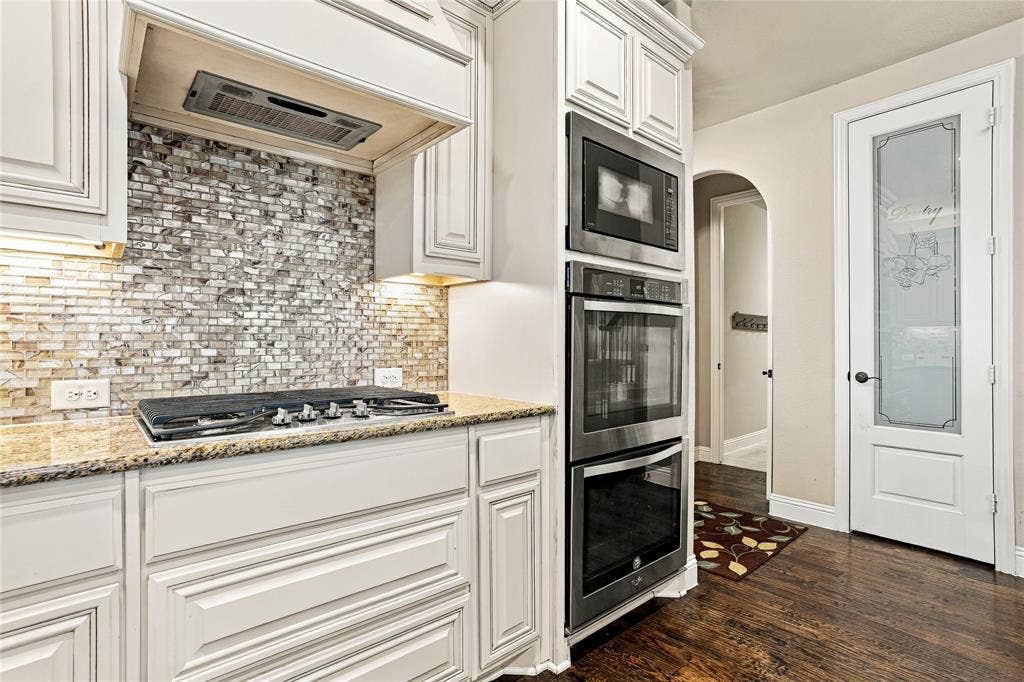 2820 Mariposa Drive, Grand Prairie, TX 75054 Additional kitchen view highlighting cabinetry and workspace.