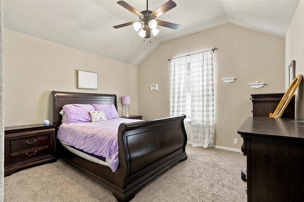 2820 Mariposa Drive, Grand Prairie, TX 75054 Additional bedroom with vaulted ceiling and abundant natural light.