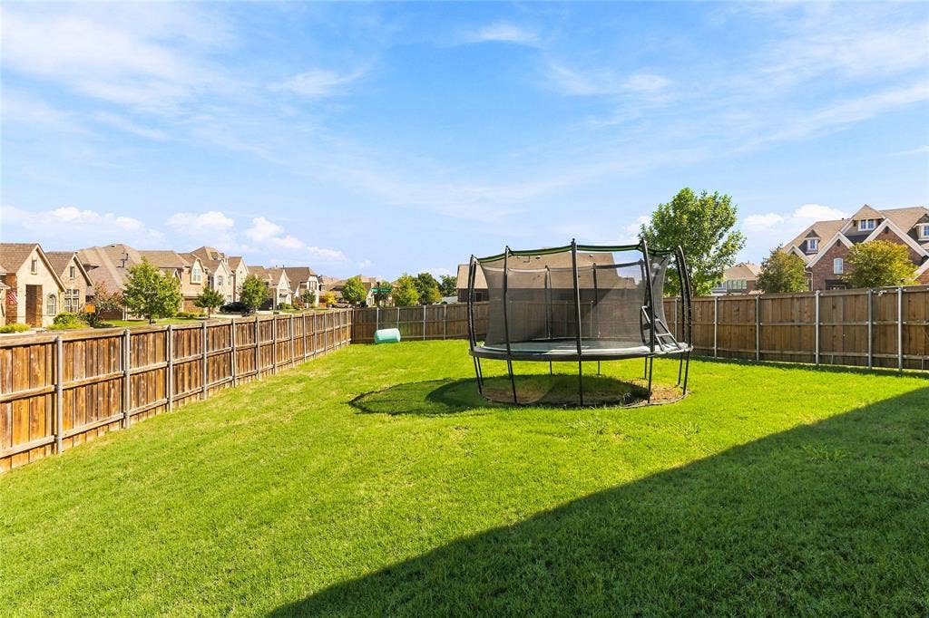 2820 Mariposa Drive, Grand Prairie, TX 75054 Expansive backyard with plenty of open green space.