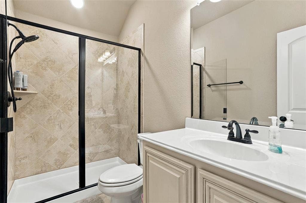 2820 Mariposa Drive, Grand Prairie, TX 75054 Full bathroom featuring a walk-in shower and spacious vanity.