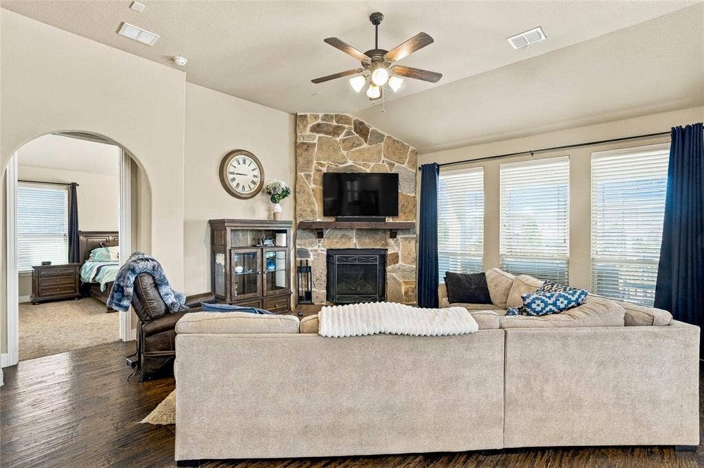 2820 Mariposa Drive, Grand Prairie, TX 75054 Comfortable living room with inviting fireplace and large windows.