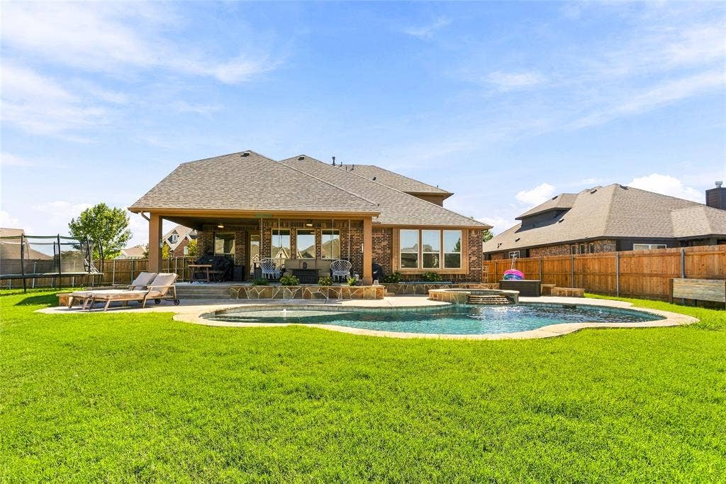2820 Mariposa Drive, Grand Prairie, TX 75054 Beautiful rear elevation with a large backyard for outdoor enjoyment.