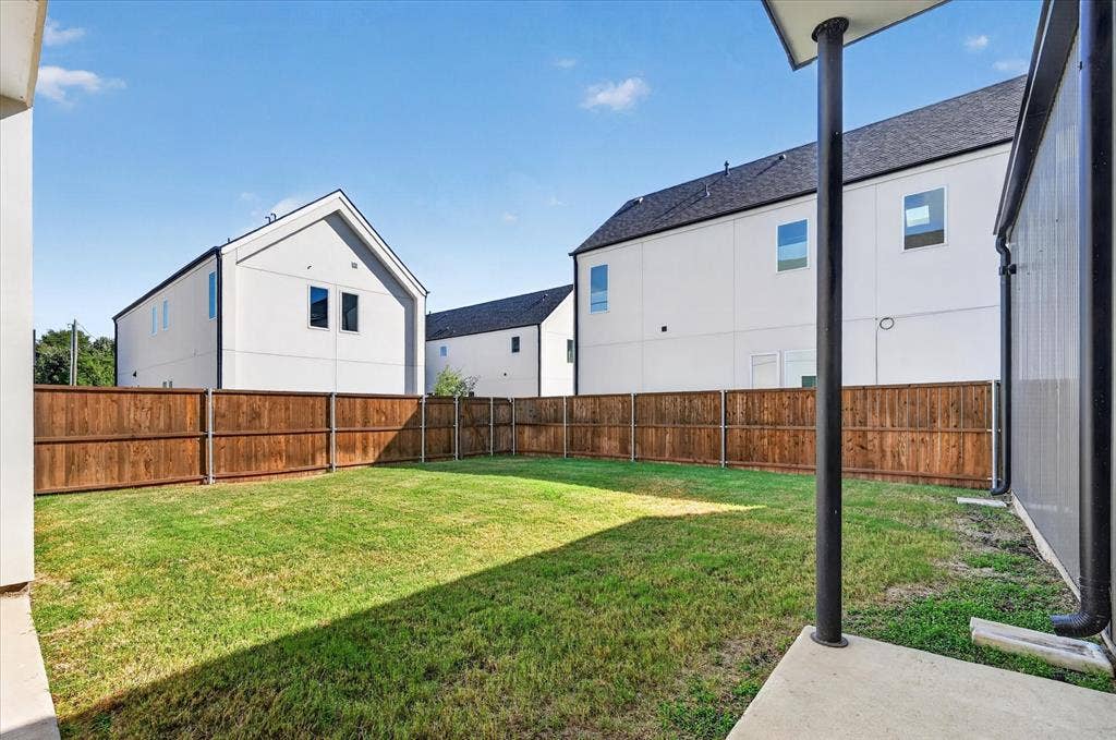 835 Nomas Street, Dallas, TX 75212 Expansive grassy yard with a privacy fence