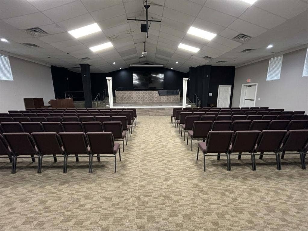 5001 Crozier Street, Dallas, TX 75215 Large open space with patterned carpet flooring, stage with decorative columns, and recessed lighting