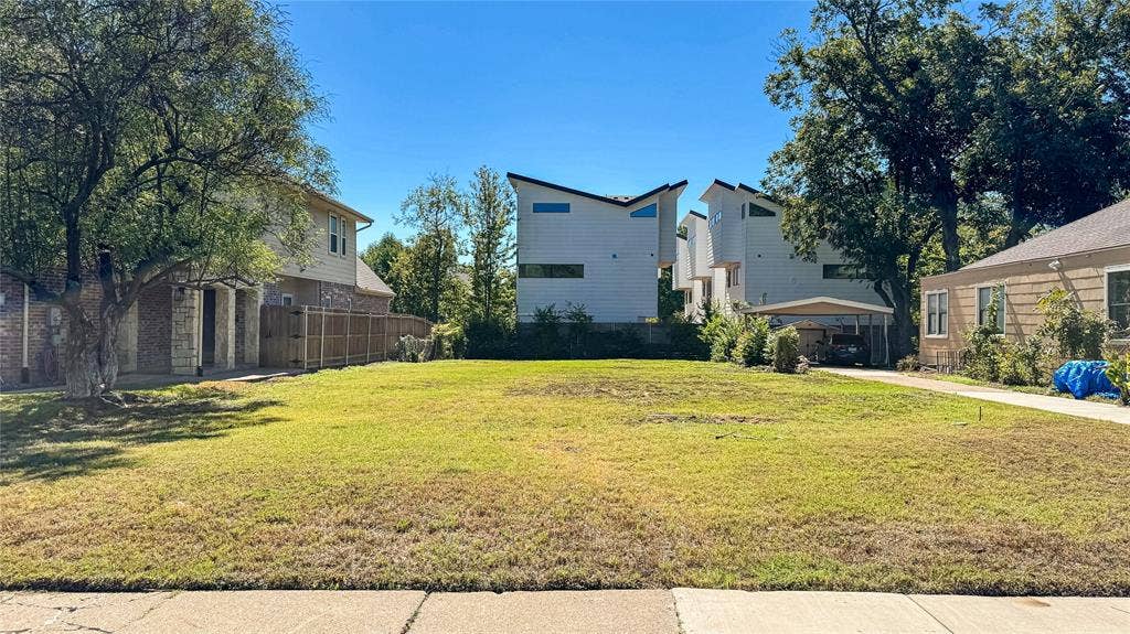 5946 Lewis Street, Dallas, TX 75206 Expansive grassy lot with mature trees defining the perimeter