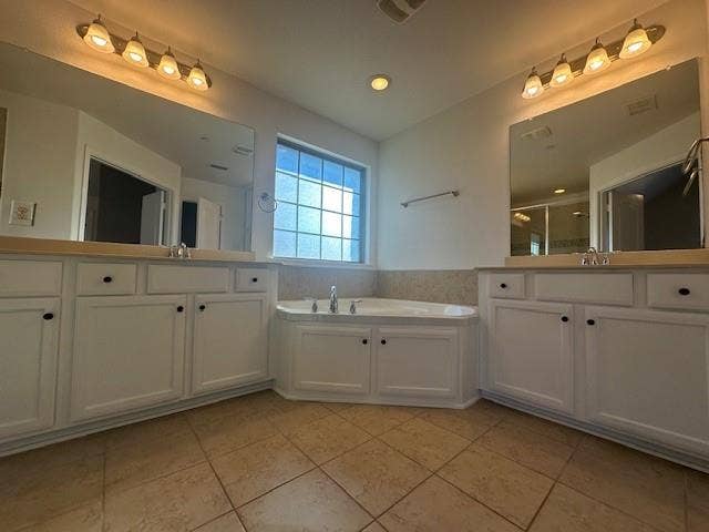 901 Brookville Court, Plano, TX 75074 Dual vanities with white cabinetry, a built-in corner tub, and tiled flooring