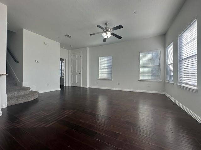 901 Brookville Court, Plano, TX 75074 Spacious room with dark wood-finish flooring, multiple windows with blinds, a ceiling fan, and recessed lighting