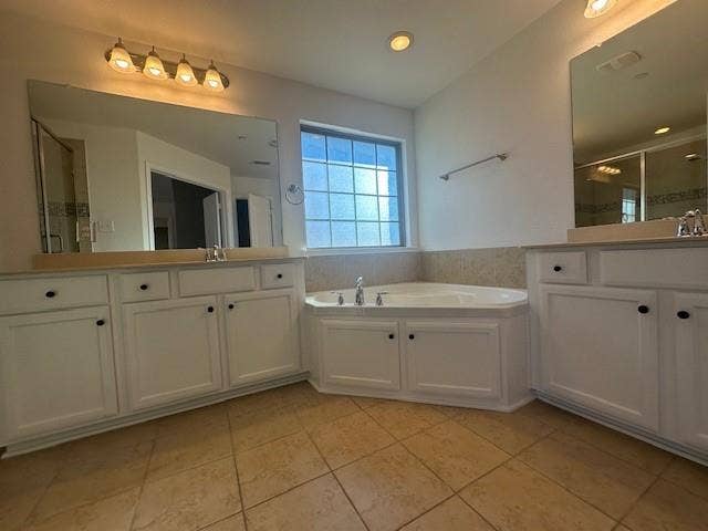 901 Brookville Court, Plano, TX 75074 Corner soaking tub, dual vanities with integrated sinks, recessed lighting, and tile flooring