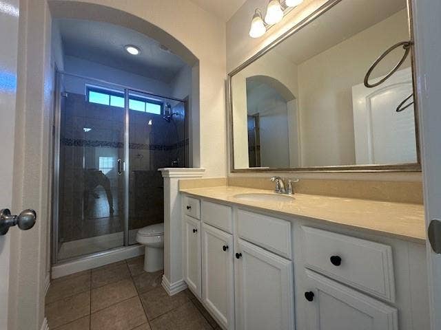 901 Brookville Court, Plano, TX 75074 White vanity cabinetry with a single sink, light-toned countertop, and framed mirror