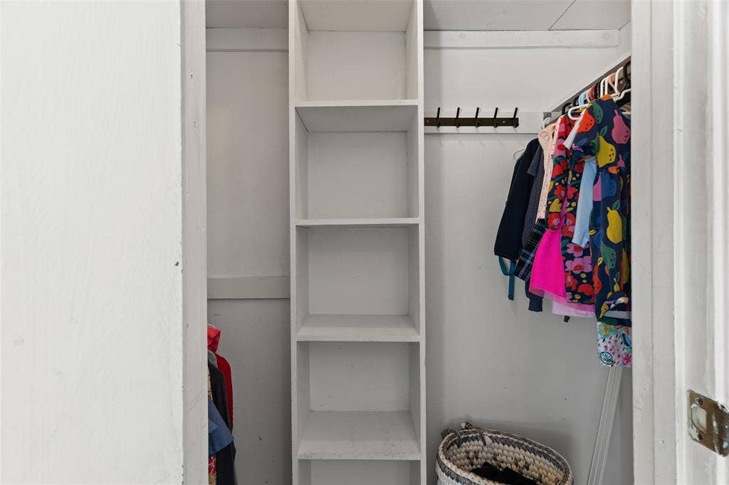841 Villa Ridge Drive, Garland, TX 75043 Integrated shelving system, clothes rod, and wall-mounted coat rack
