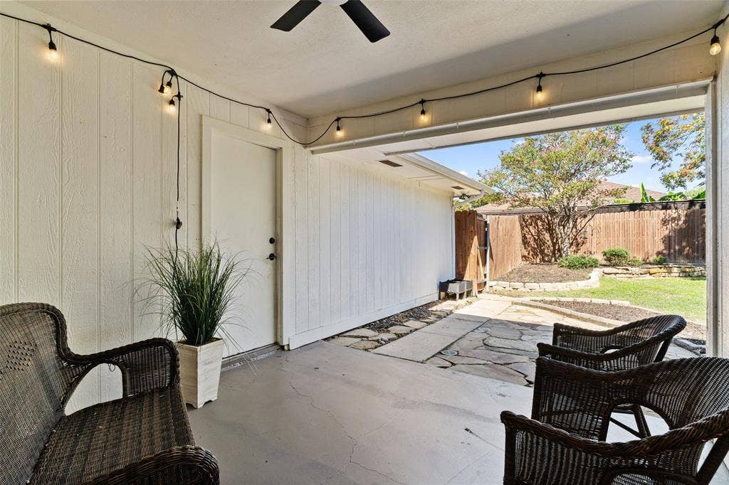 841 Villa Ridge Drive, Garland, TX 75043 Covered patio with concrete flooring, string lighting, and direct access to the backyard
