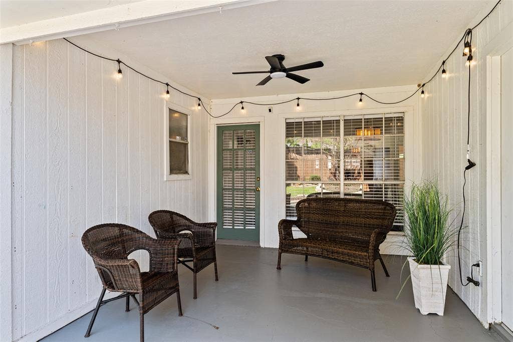 841 Villa Ridge Drive, Garland, TX 75043 Covered patio featuring a ceiling fan, string lighting, and a sliding glass door