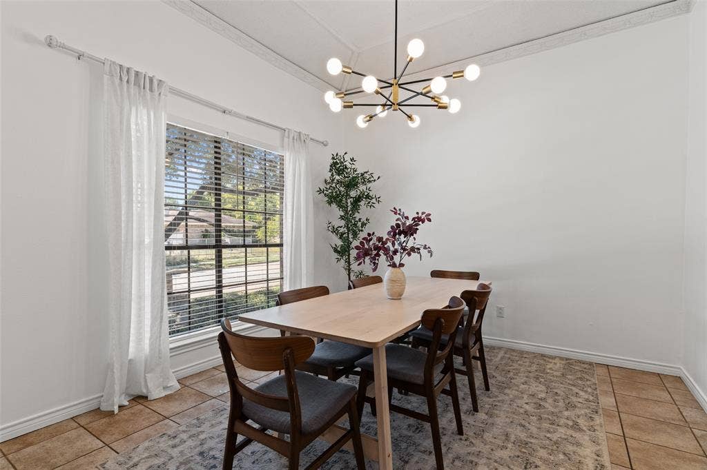841 Villa Ridge Drive, Garland, TX 75043 Recessed ceiling with decorative trim, contemporary chandelier, large window with blinds, and tile flooring