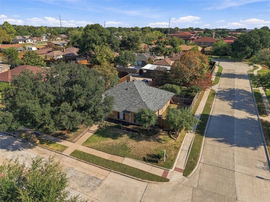 841 Villa Ridge Drive, Garland, TX 75043 Corner lot with mature trees, established landscaping, and a fenced yard