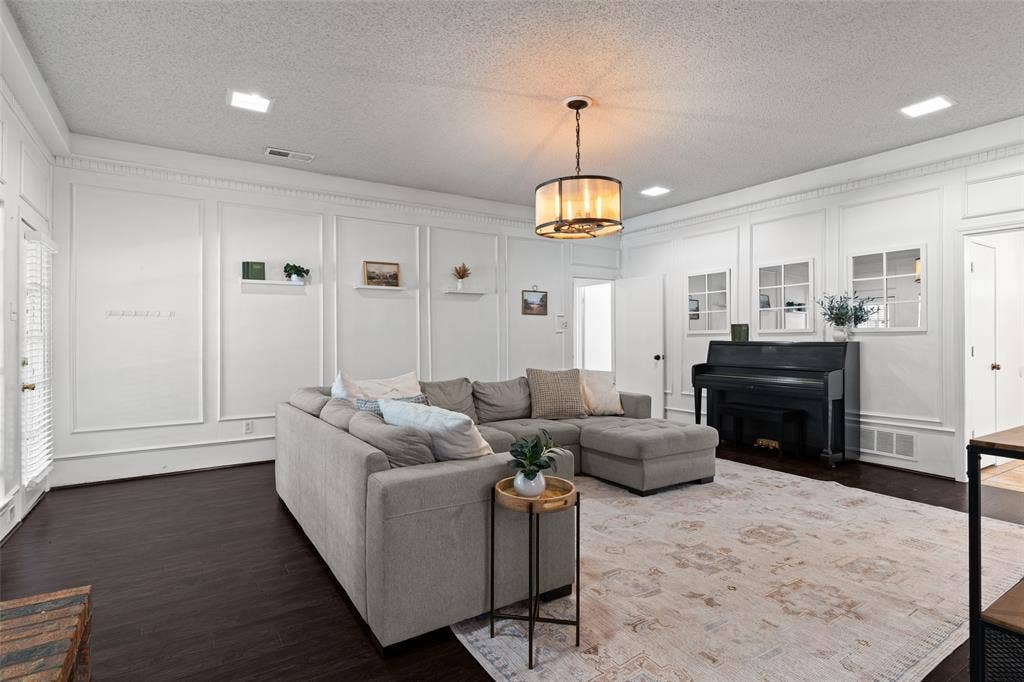 841 Villa Ridge Drive, Garland, TX 75043 Living area featuring dark wood-finish flooring, white panel molding, recessed lighting, and a drum-style chandelier