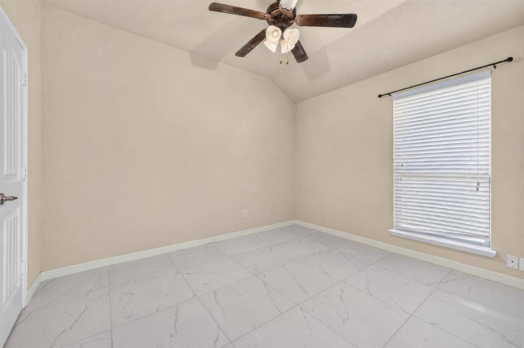 1048 Mercury Drive, Lavon, TX 75166 Varying ceiling height with a ceiling fan, window with blinds, light-toned walls, and large format tile flooring