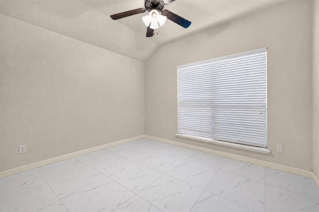 1048 Mercury Drive, Lavon, TX 75166 Vaulted ceiling, ceiling fan, large window with blinds, tile flooring, and light-toned walls