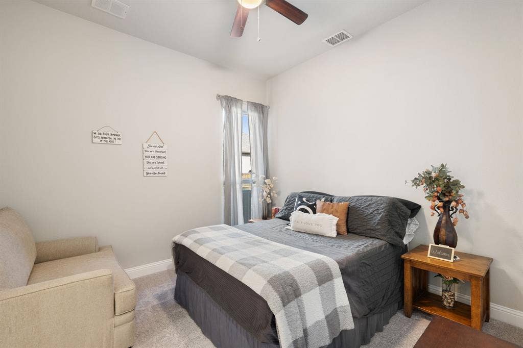 Recessed lighting, ceiling fan with light fixture, window with curtains, light-toned carpeting, and neutral wall paint