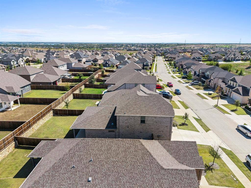 Expansive neighborhood featuring numerous residential properties, well-maintained streets, and individual fenced yards