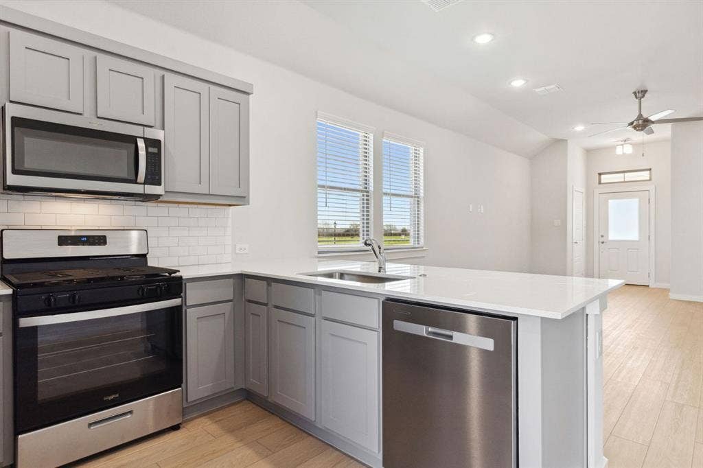 115 Longhorn Lane, Lavon, TX 75166 Kitchen in the Ash home plan – REPRESENTATIVE PHOTO