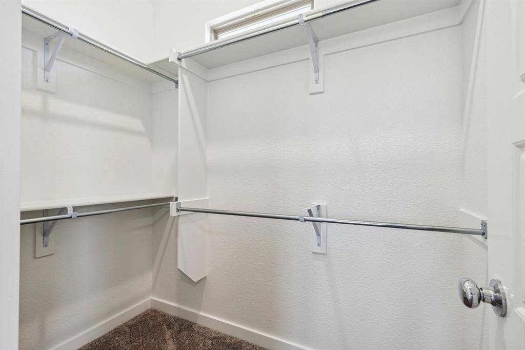 115 Longhorn Lane, Lavon, TX 75166 Primary Closet in the Ash home plan – REPRESENTATIVE PHOTO