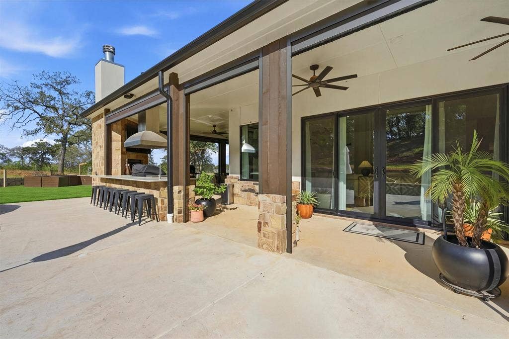 Back patio leading to pool - covered porch with automatic screen system