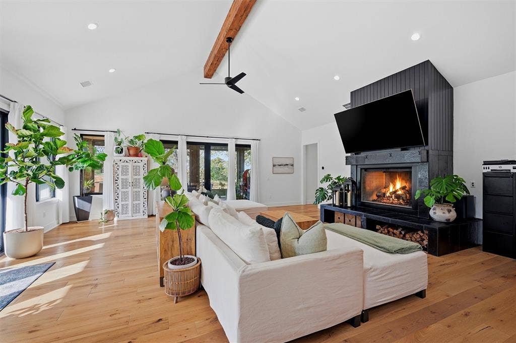 Living Area - wood burning fireplace with gas ignition system