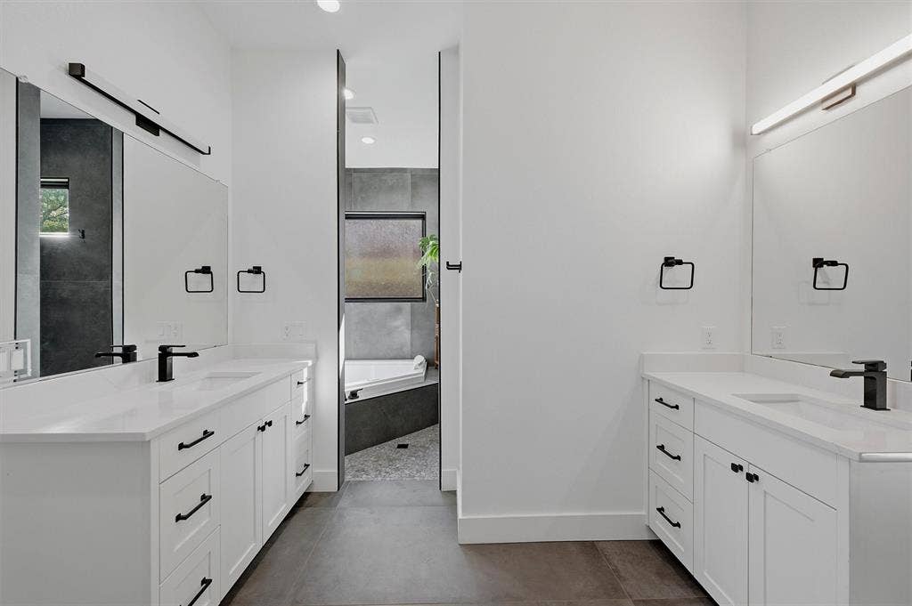 Primary bathroom - dual vanities, jetted soaking tub, stand-alone shower