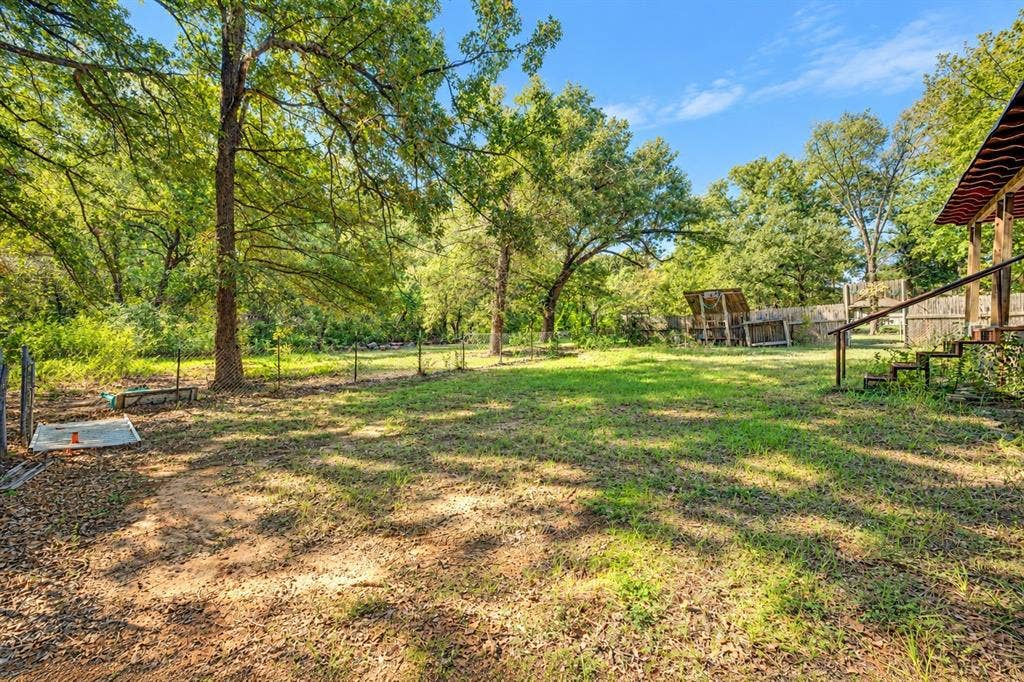 103 Cedar Ridge Drive, Eustace, TX 75124 Yard is cross fenced, property line goes past the fence.