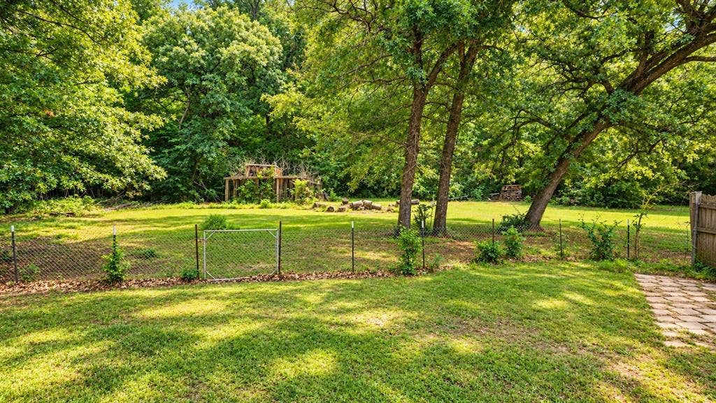 103 Cedar Ridge Drive, Eustace, TX 75124 Yard is cross fenced, property line goes past the fence.