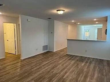 610 Grenada Lake Drive, Princeton, TX 75407 Wood-finish flooring throughout, recessed ceiling lighting, flush mount ceiling light, white interior doors