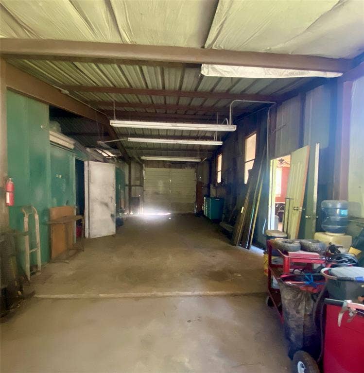 Looking into garage from workshop area.