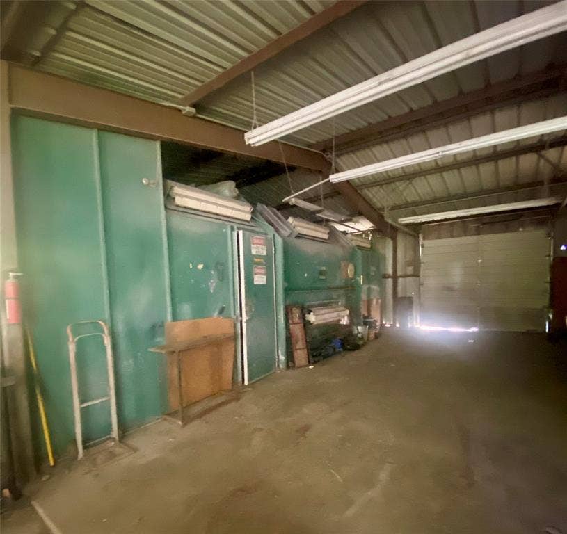 Garage area with paint booth in green